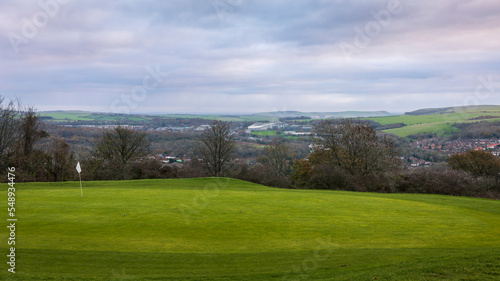 View east of the south downs and amex stadium from Hollingbury hill fort and golf course Brighton south east England UK