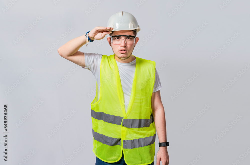 Handsome engineer looking into the distance isolated, Young engineer looking at something in the distance isolated, Builder engineer looking into something in the distance Handsome engineer looking into the distance isolated, Young engineer looking at something in the distance isolated, Builder engineer looking into something in the distance