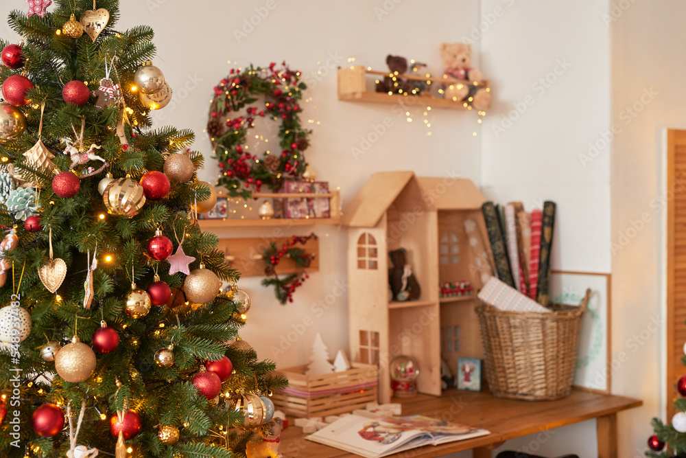Christmas and New Year decor background. Christmas tree and toys. Santa's Residence. Holiday apartment interior.
