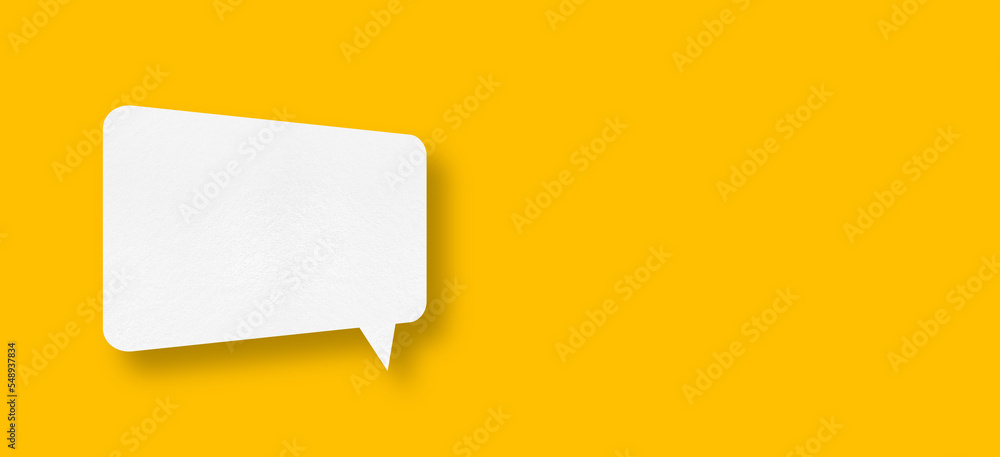 speech balloon shape white paper isolated on yellow background speech balloon shape white paper isolated on yellow background