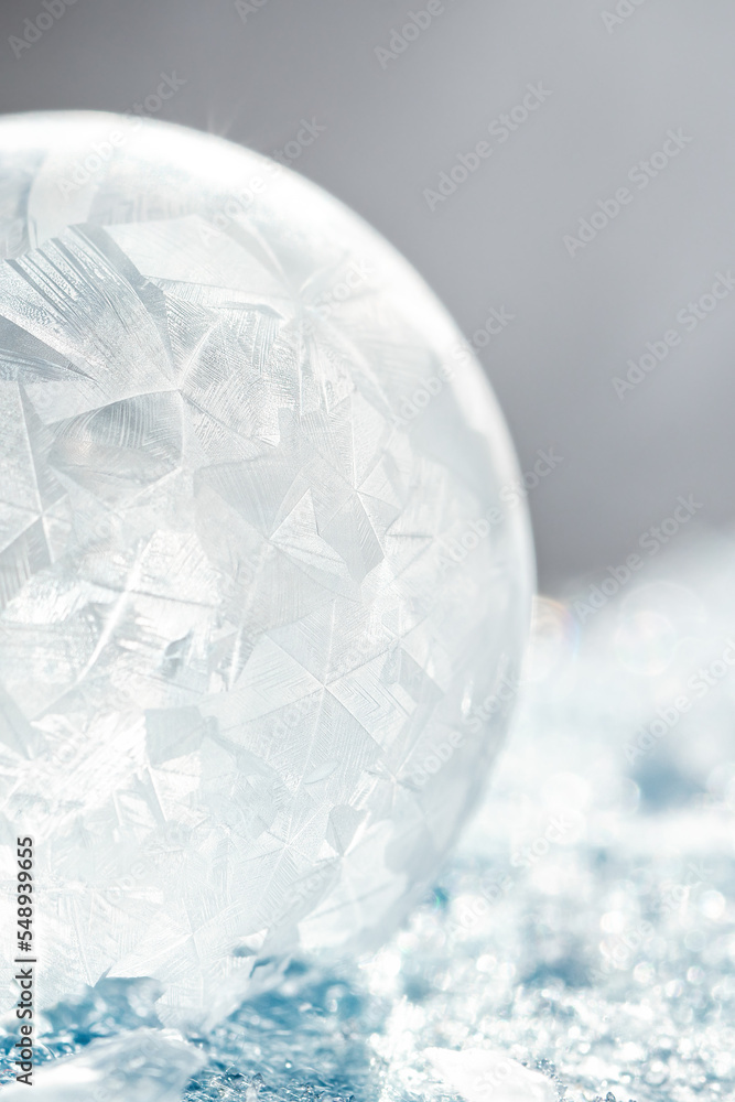 Beautiful frosty patterns on frozen soap bubble. winter, frosty background. Macro photo Beautiful frosty patterns on frozen soap bubble. winter, frosty background. Macro photo