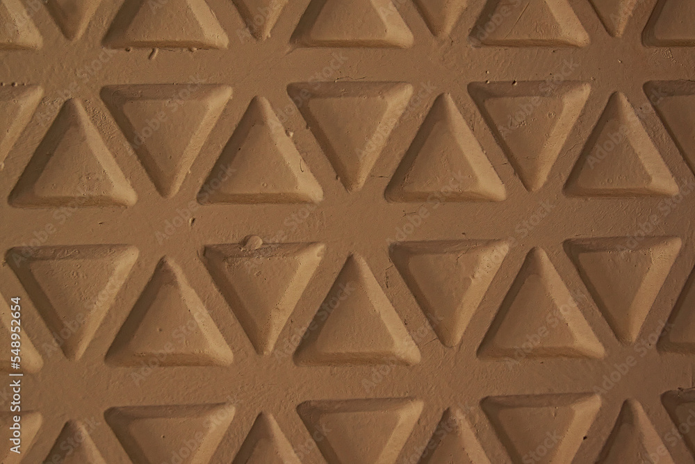 drawing on the wall. plaster tiles on the wall. triangle pattern. drawing on the wall. plaster tiles on the wall. triangle pattern.