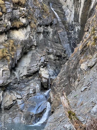 Waterfalls in the small wild alpine canyon of Parlitobel above the Gigerwaldsee reservoir and over the Calfeisental valley (UNESCO World Heritage Tectonic Arena Sardona), Vättis - Switzerland (Schweiz