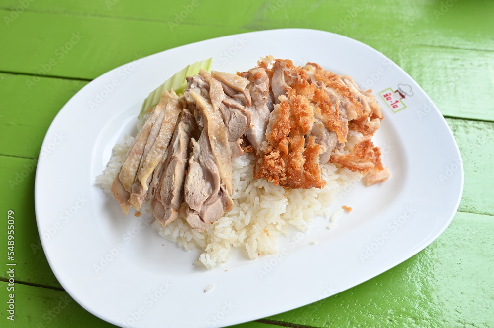 steamed rice topped with chicken.Rice topped with boiled chicken oup, and spicy sauce,thai food,chicken rice service,Fried Chicken with Rice. steamed rice topped with chicken.Rice topped with boiled chicken oup, and spicy sauce,thai food,chicken rice service,Fried Chicken with Rice.