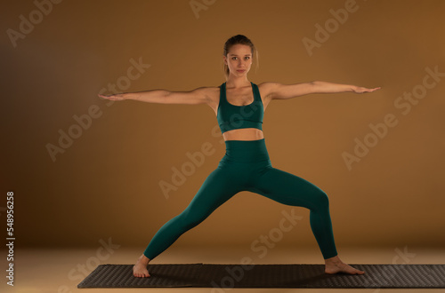 Yoga pose and focusing while smiling