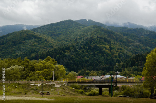 pedestrian bridge in summer mountains, carpathians, Ukraine