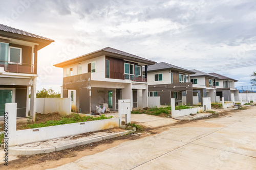 construction residential new house in progress at building site © Piman Khrutmuang