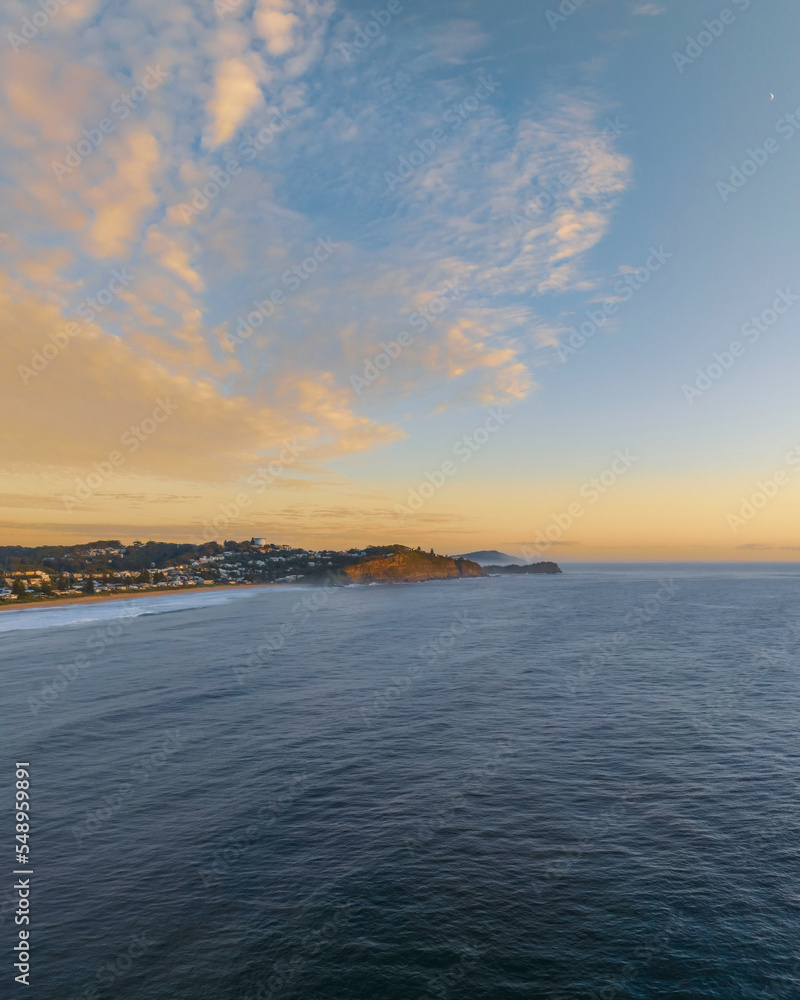 Sunrise over the ocean with rocks