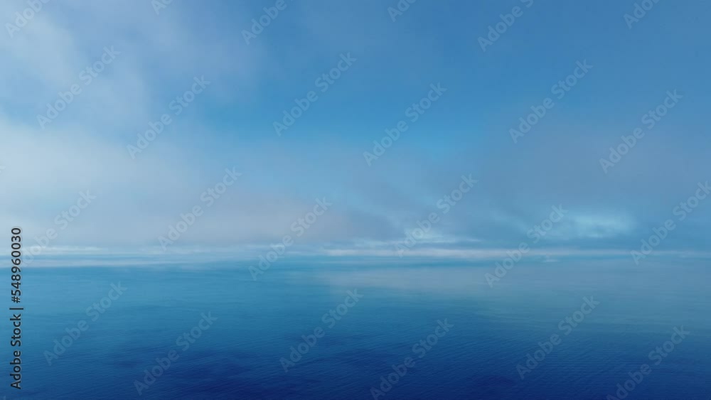 Fog over sea. Abstract aerial nature summer ocean sunset sea and sky background. Small waves on clear water surface with bokeh lights from sunrise. Holiday, vacation and recreational concept Fog over sea. Abstract aerial nature summer ocean sunset sea and sky background. Small waves on clear water surface with bokeh lights from sunrise. Holiday, vacation and recreational concept