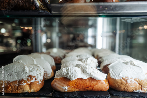 Delicious creamy typical pastry from Rome called Maritozzo photo