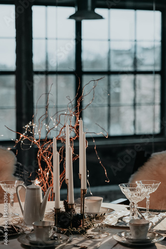 Slika na platnu Christmas table setting with cups, candles, glasses. Teatime