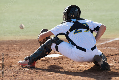 Wall Mural Baseball catcher during game, baseball catcher reaching to catch ball