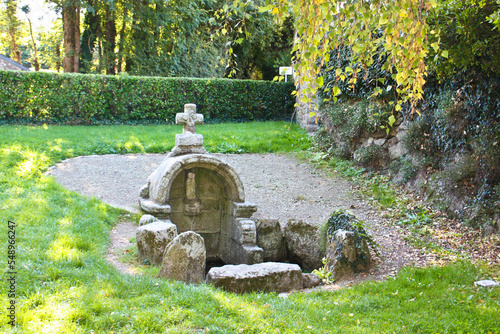 Old fountain in the park of Penmarch