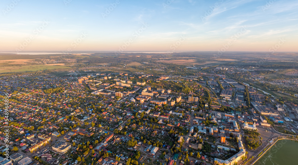 Votkinsk, Russia. Panorama of the city. Sunset time. Aerial view. The Kama River on the horizon