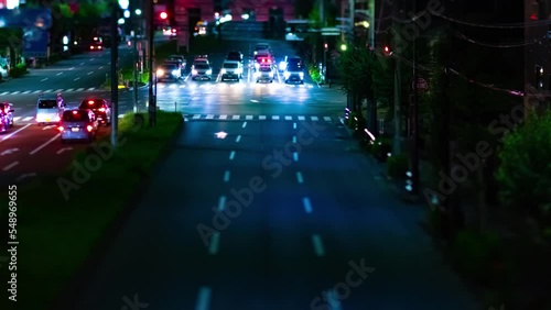 A night timelapse of the miniature traffic jam at the downtown street in Tokyo photo