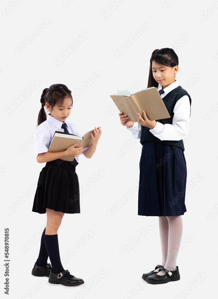 Junior school girl uniform standing and reading book full length white background. Junior school girl uniform standing and reading book full length white background.