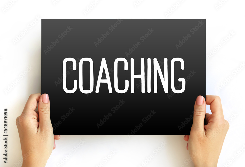 Coaching - form of development in which an experienced person supports a learner in achieving a specific personal or professional goal, text concept on card Coaching - form of development in which an experienced person supports a learner in achieving a specific personal or professional goal, text concept on card