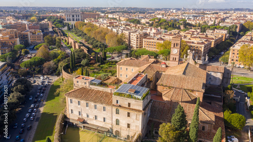 Aerial view of Basilica of the Holy Cross in Jerusalem in Rome, Italy. In background the Papal Archbasilica of Saint John Lateran, also referred to as the Cathedral of city.