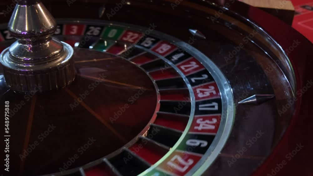 The ball jumps on the roulette table in the casino The ball jumps on the roulette table in the casino