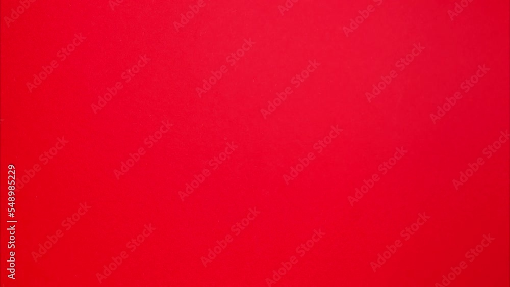 Stop motion animation. Red Christmas balls on a red theme. Monochrome ornament rotates on a red background Stop motion animation. Red Christmas balls on a red theme. Monochrome ornament rotates on a red background