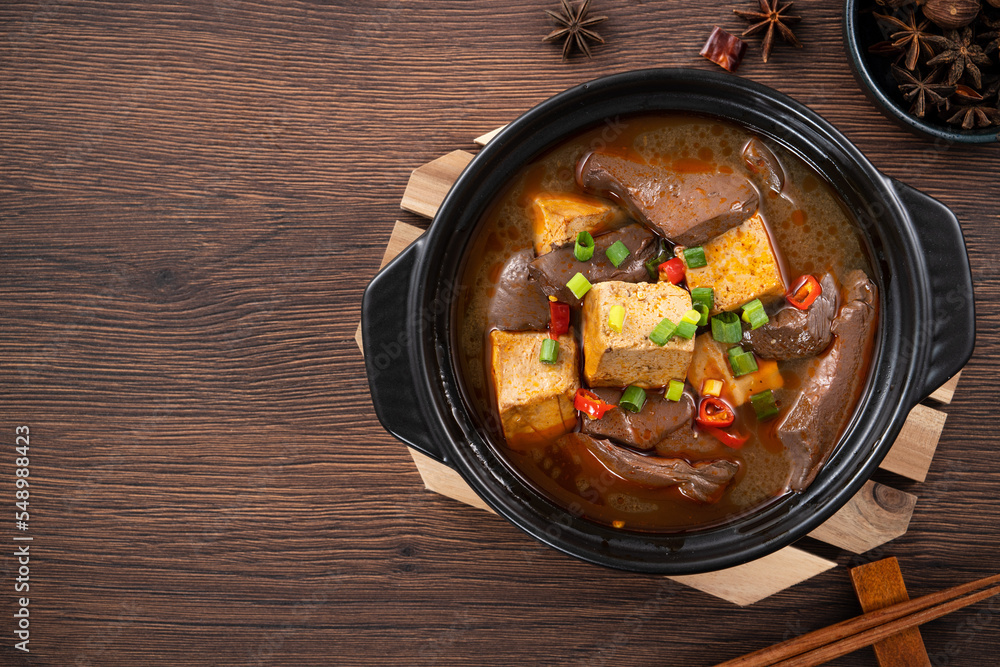 Spicy duck blood jelly soup and stinky tofu with scallion and chili pepper topping. Spicy duck blood jelly soup and stinky tofu with scallion and chili pepper topping.