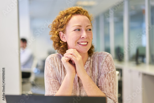Young business woman at the computer in the office