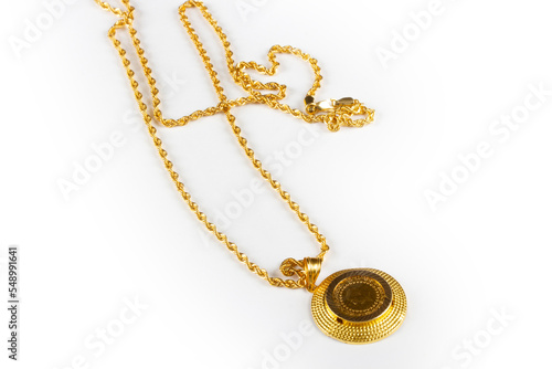 Gold chain necklace on a white background