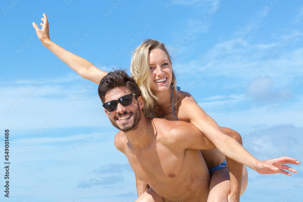 young couple having fun at the beach young couple having fun at the beach
