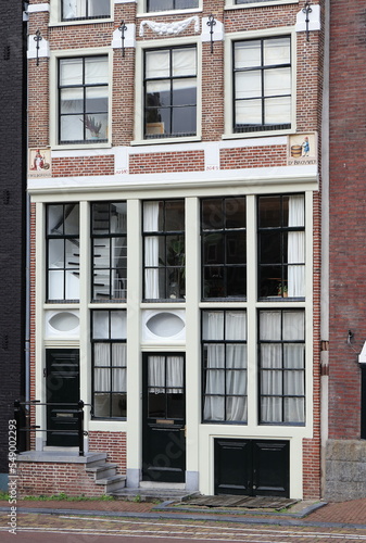 Amsterdam Egelantiersgracht Canal Brick House Facade with Sculpted Stone Tablets, Netherlands © Monica