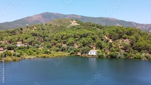 Aerial view of lake house and mountain landscape in Andalucia Spain