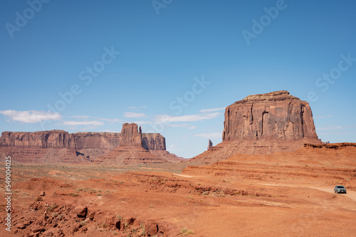 Nice desert landscape with rocky Monument Valley. It s a sunny summer day with blue sky