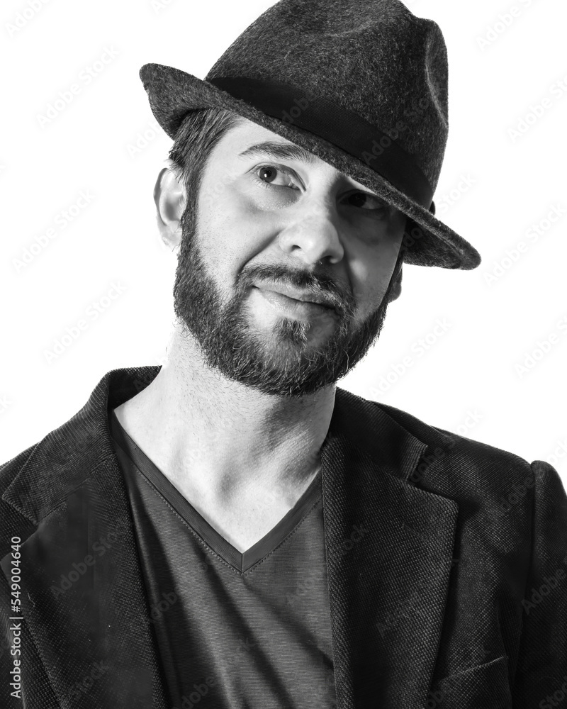 Portrait of man with beard in fedora hat in white background Portrait of man with beard in fedora hat in white background