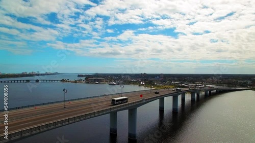 Wallpaper Mural Aerial Panning Shot Of Vehicles Moving On Bridge In City Under Clouds, Drone Flying Over Sea - Daytona Beach, Florida Torontodigital.ca