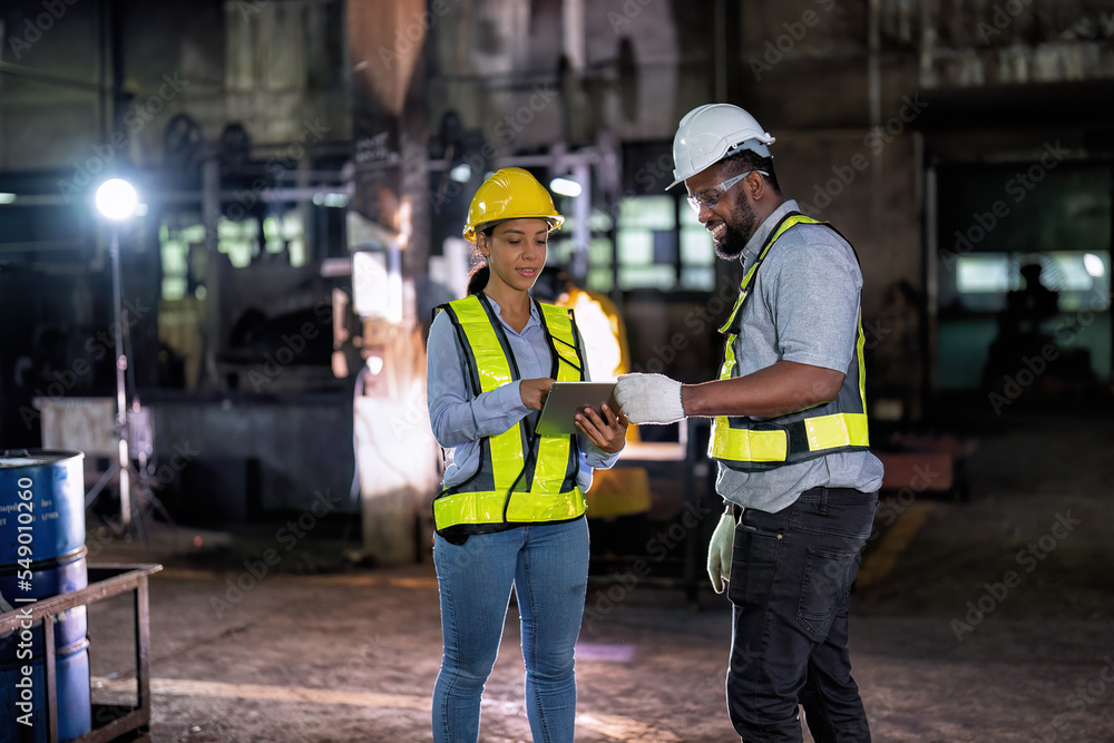 © Tongpool - Maintenance engineer and manager in factory talking about part available repair machine