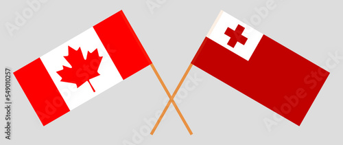 Crossed flags of Canada and Tonga. Official colors. Correct proportion