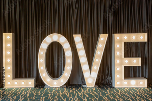 LOVE Light Letters Background in front of curtain