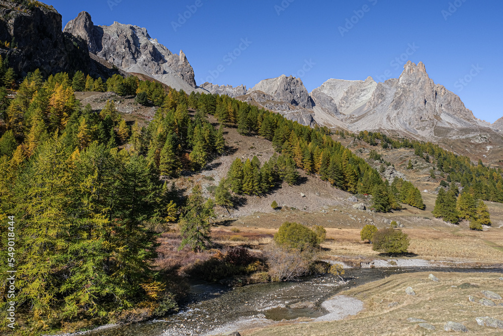 View of the scenic Valee de la Claree in the French Alps with Massif de Cerces mountains on either side of the valley, near Briancon, France