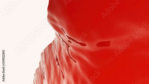 Close up of red rippling red jelly substance on a white background. Design. Abstract hardened jelly wobbling.
