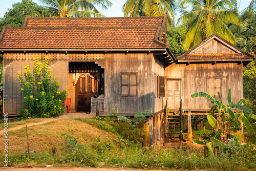 Fotografi Wooden Home at Golden Hour, Kampong Cham Cambodia