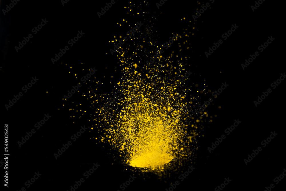 Colored powder explosion isolated on black background