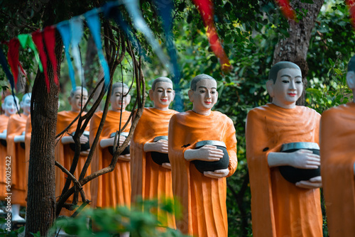 Fényképezés Statues of Monks With Alms Bowls, Phnom Sambok Pagoda, Cambodia