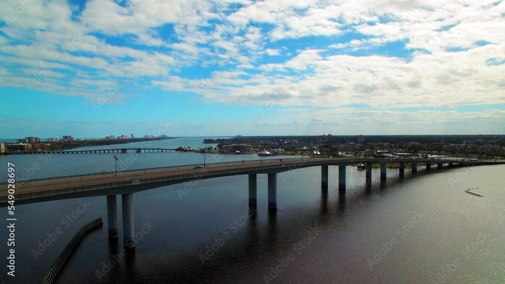 Aerial Backward Beautiful View Of Bridges Over Sea Under Cloudy Sky - Daytona Beach, Florida Aerial Backward Beautiful View Of Bridges Over Sea Under Cloudy Sky - Daytona Beach, Florida