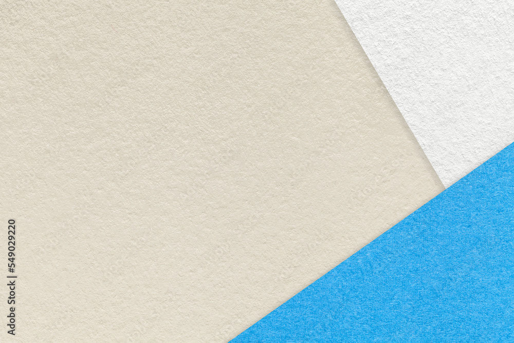 Texture of craft light beige color paper background with blue and white border. Vintage abstract sand cardboard. Texture of craft light beige color paper background with blue and white border. Vintage abstract sand cardboard.
