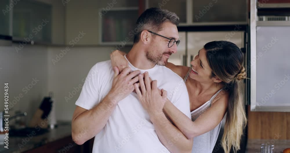 Love, couple and hug in kitchen, happy and quality time together, at home or smile. Man, woman and embrace in morning, happiness and relax for healthy relationship, dating and bonding being loving Love, couple and hug in kitchen, happy and quality time together, at home or smile. Man, woman and embrace in morning, happiness and relax for healthy relationship, dating and bonding being loving