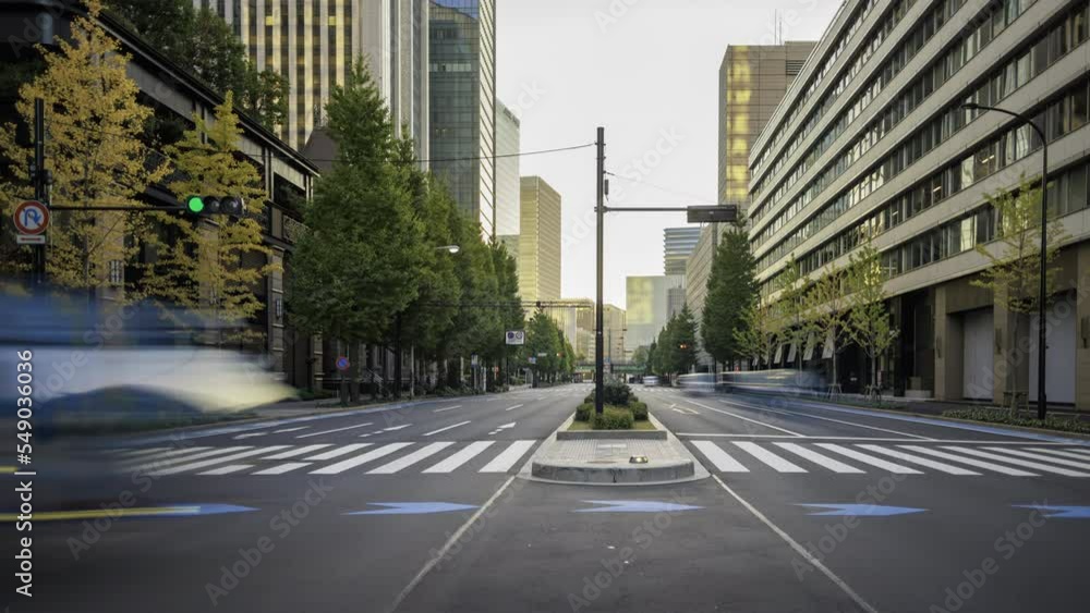 Time lapse: Early morning traffic at busy downtown intersection Time lapse: Early morning traffic at busy downtown intersection
