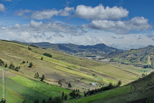 Patchwork of farm fields on the slope of a mountain near Latacunga, Ecuador © Angela