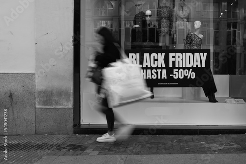 Wallpaper Mural Madrid, Spain- November 25, 2022: Black Friday begins in the streets of Madrid. People with bags on the streets during Black Friday. Madrid's Gran Via fills up with people during Black Friday Torontodigital.ca