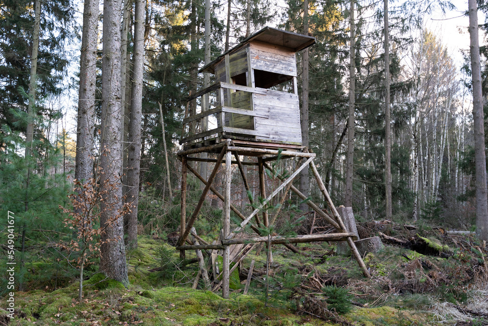 Wooden hunters perch in the forest