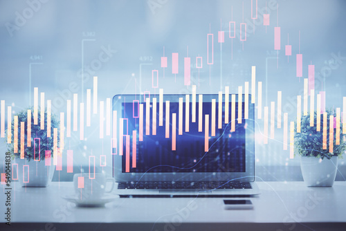 Forex graph hologram on table with computer background. Multi exposure. Concept of financial markets.