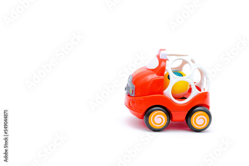 little red plastic car toy for newborn babies isolated, toys for children, kids development, playing